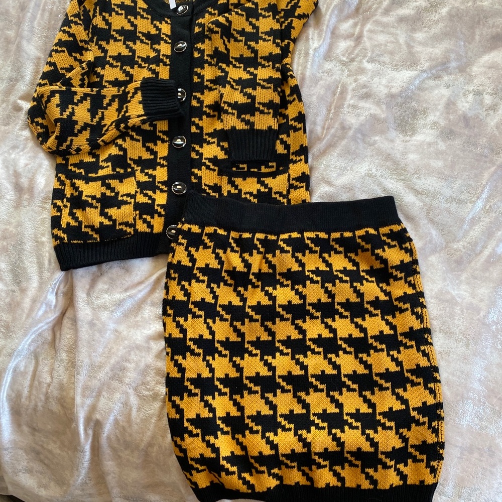 Cardigan and skirt knit set.